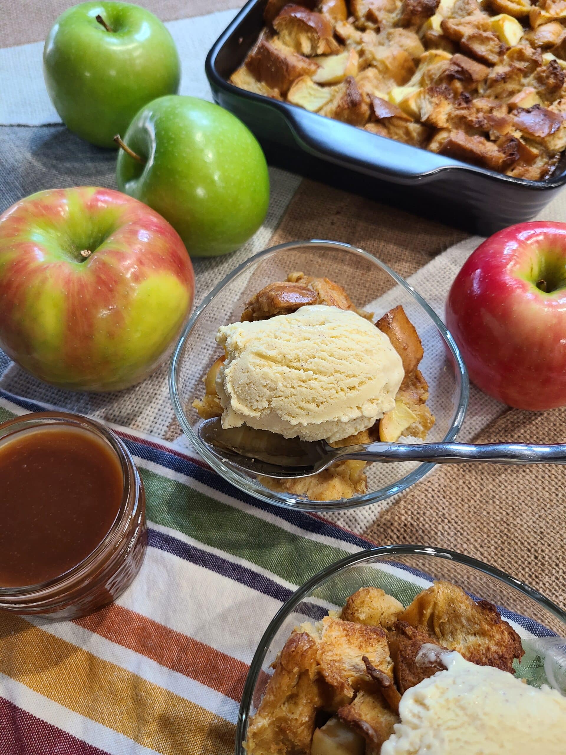 Caramel apple bread pudding in a glass bowl