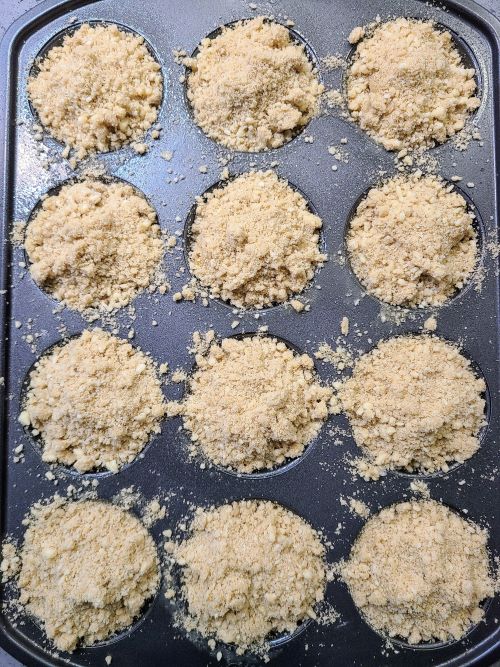 adding streusel to coffee cake muffins