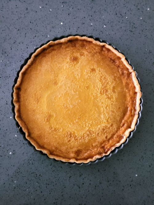 the Crème Brûlée Tart after baking before the sugar topping