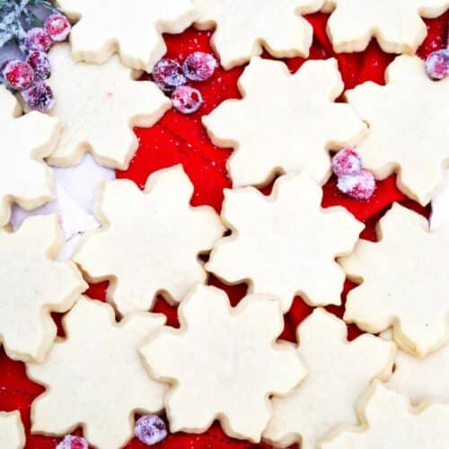 Sugar cookies with sugared cranberries and rosemary