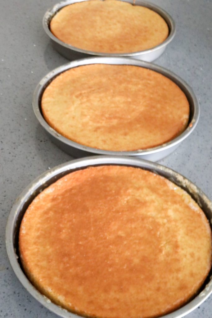 3 cake pans of cooked cakes for strawberry shortcake