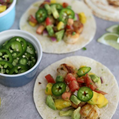 Scallop tacos with small bowl of sliced jalapeños