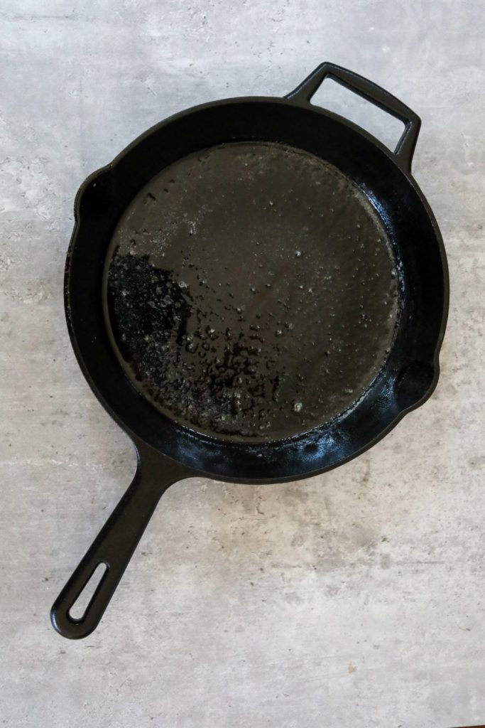 Hot cast iron skillet with melted butter