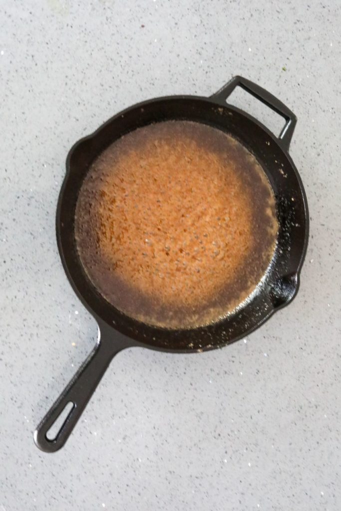 caramel sauce in a cast iron skillet