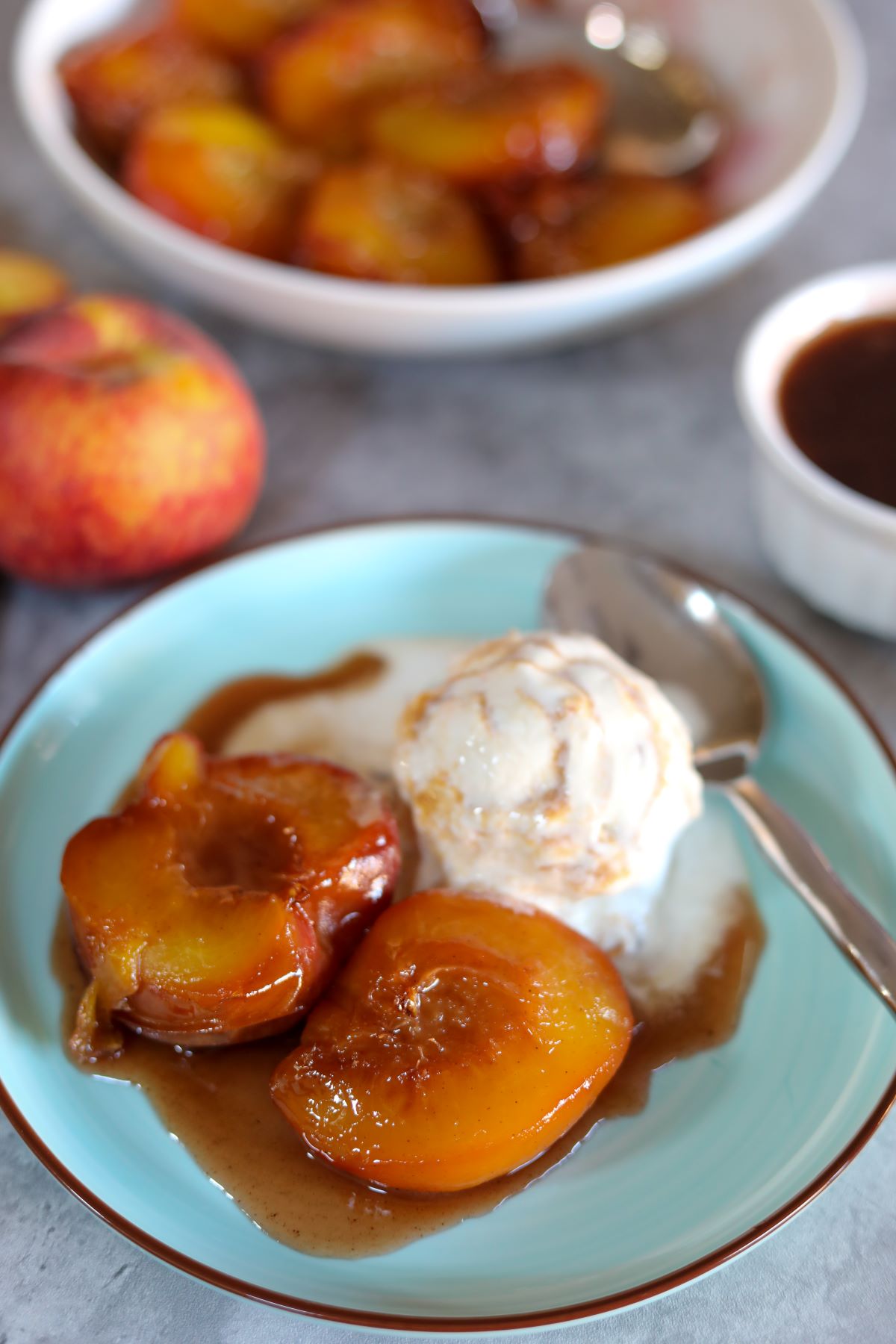 A blue plate with bourbon baked peaches