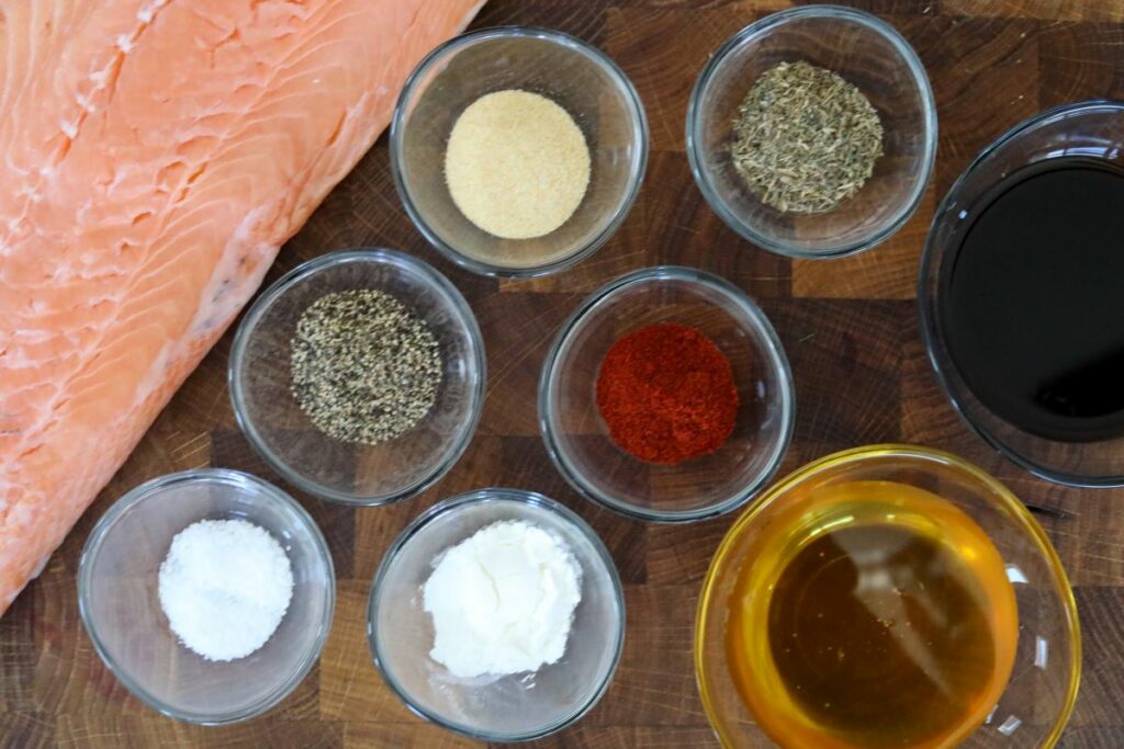 Baked salmon ingredients on a wooden cutting board