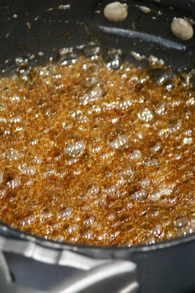 Bubbling brown sugar in a pot