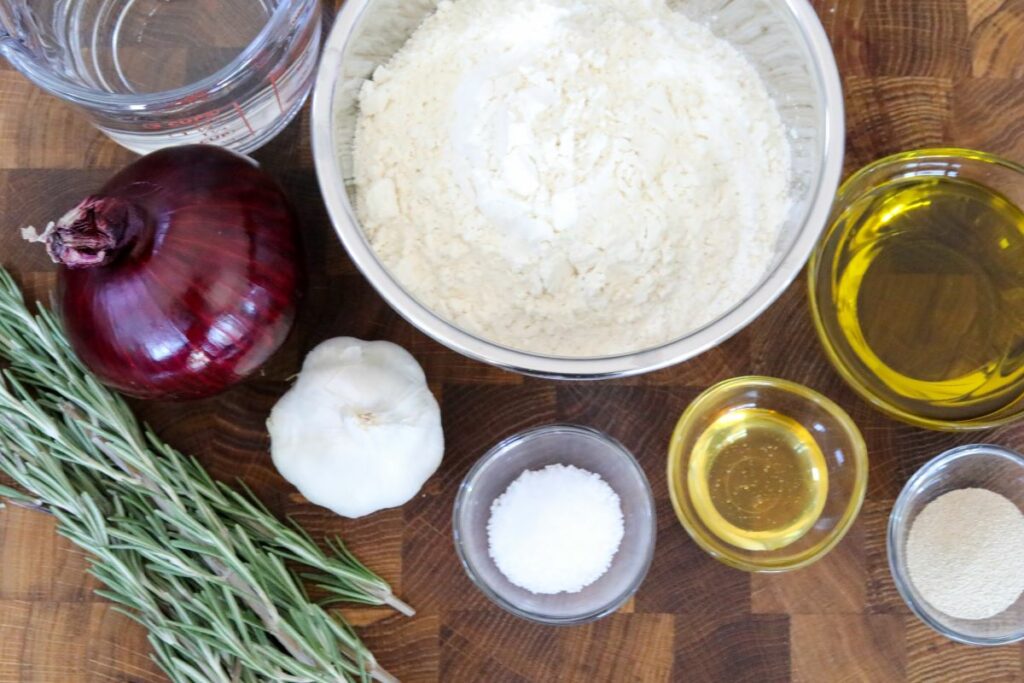 Ingredients for garlic focaccia on a cutting board