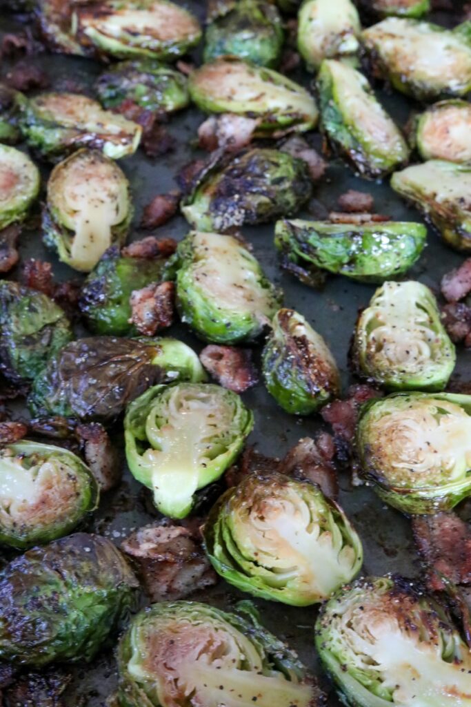 Roasted brussels sprouts and bacon on a sheet pan
