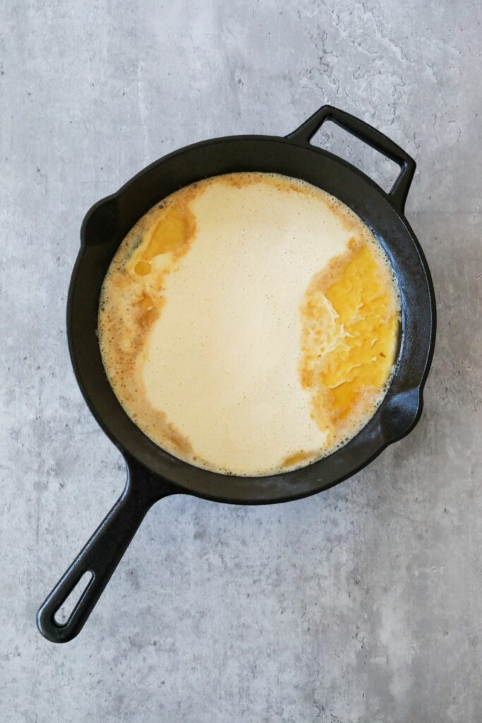 Dutch baby batter in a cast iron skillet