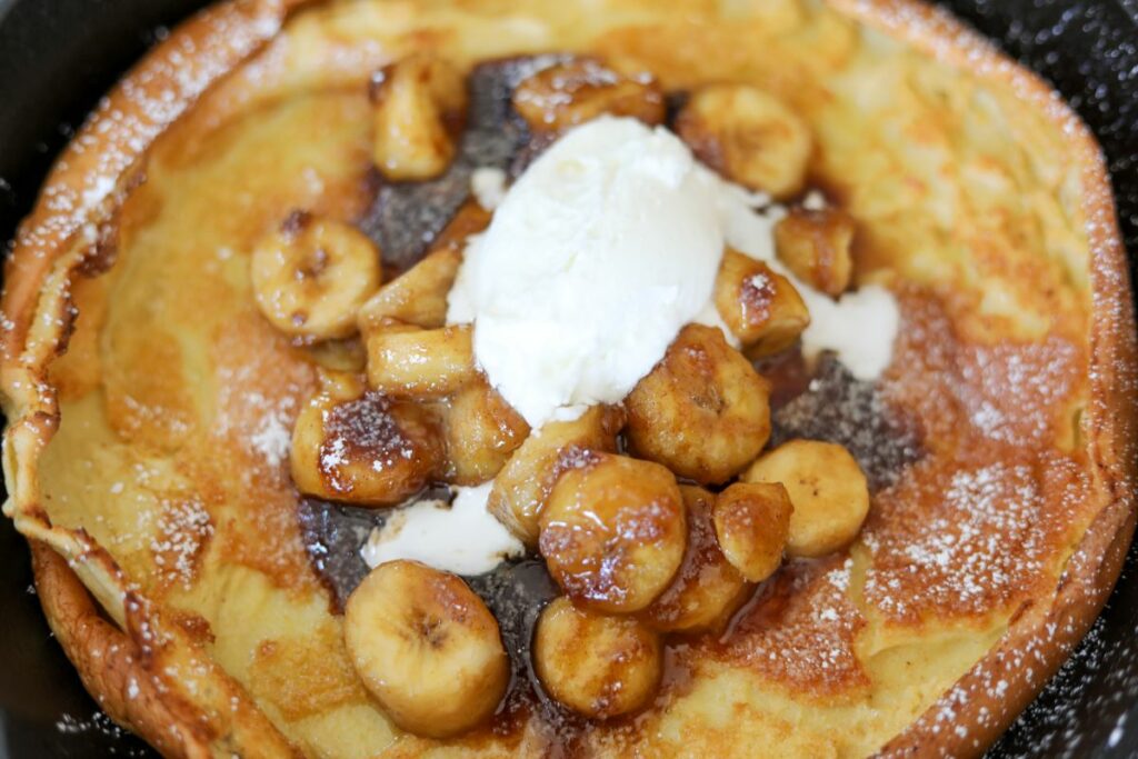 Close up of bananas foster Dutch baby