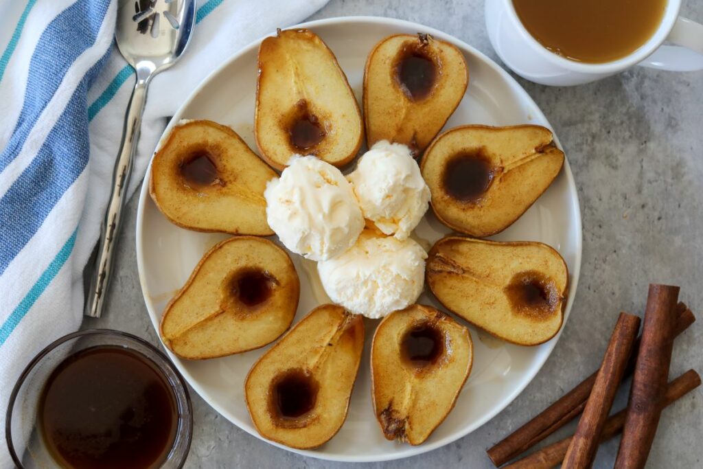 Eight pear halves on a white plate