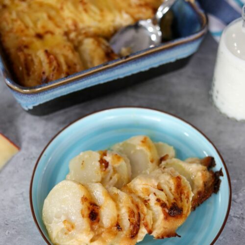 Scalloped potatoes on a blue plate