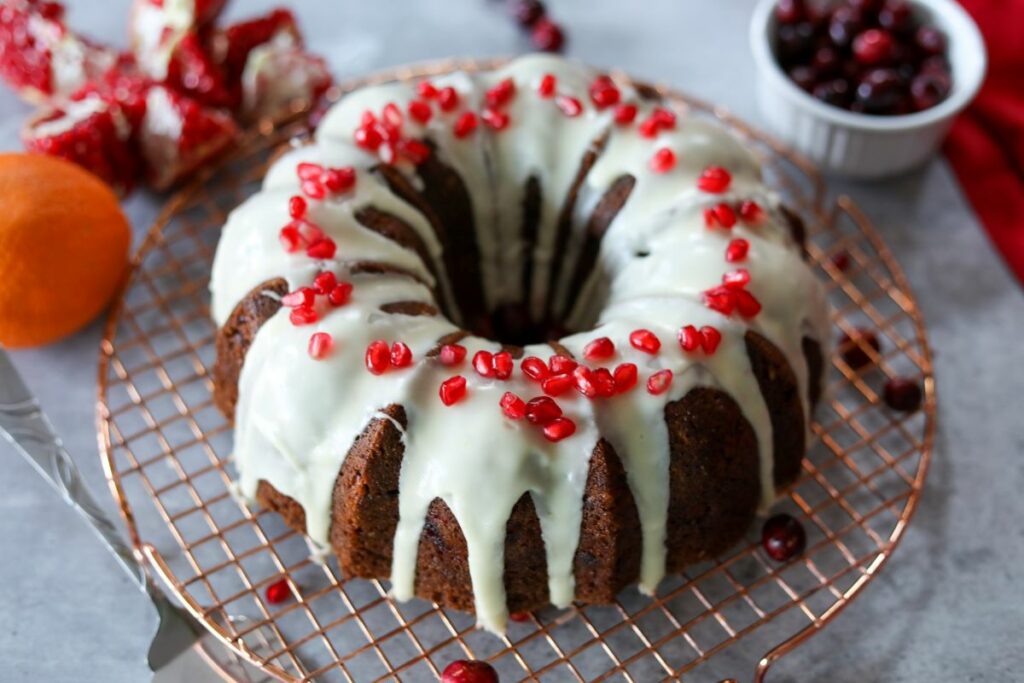 cranberry pomegranate cake on a cooling rack