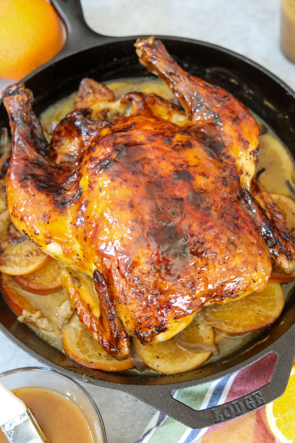 orange glazed chicken in a cast iron skillet