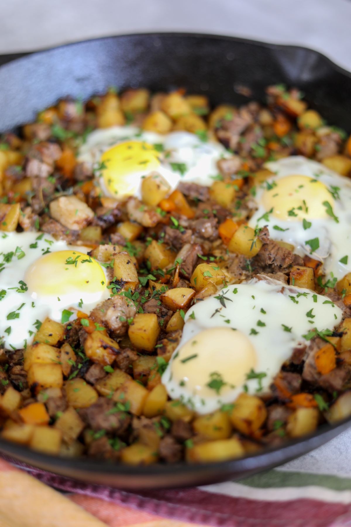 Steak and potato hash in a cast iron skillet