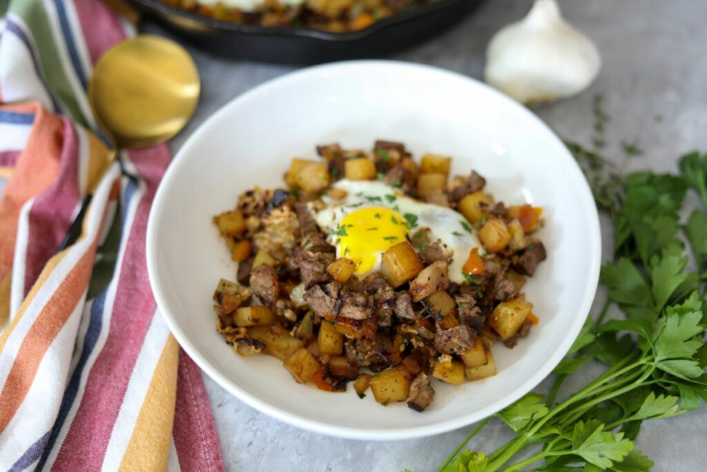 A serving of potato hash in a white