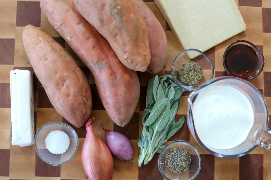 Ingredients for sweet potato casserole on a wooden cutting board