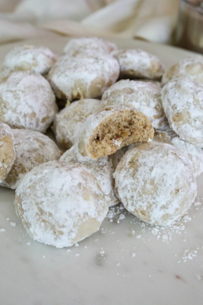 Close up of a mound of Mexican wedding cookies