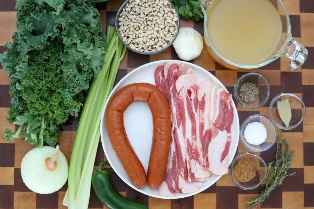 Ingredients for Southern black-eyed peas on a wooden cutting board
