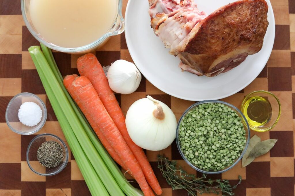 Ingredients for split pea soup on a wooden cutting board