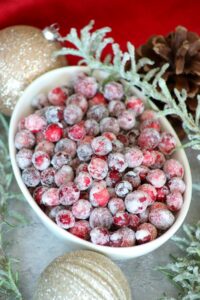 close up of a bowl of sugared cranberries