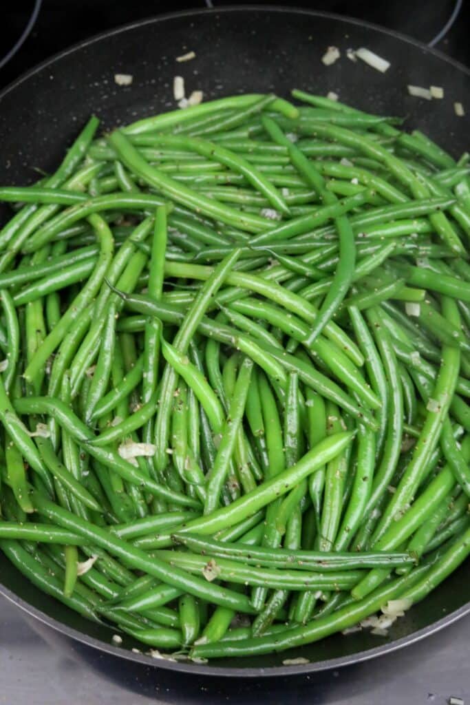 Sautéed green beans in a skillet