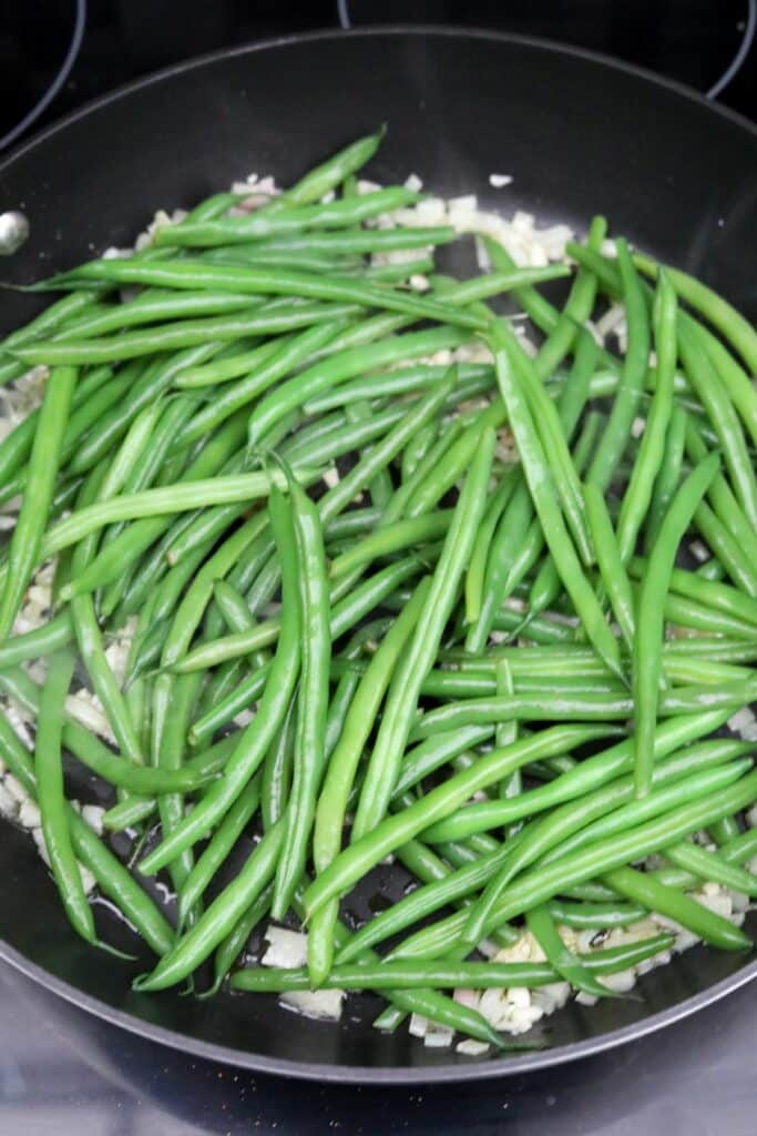 Sautéing green beans in a skillet