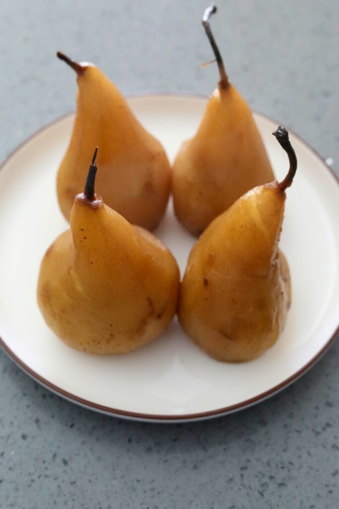 Cooling pears on a white plate