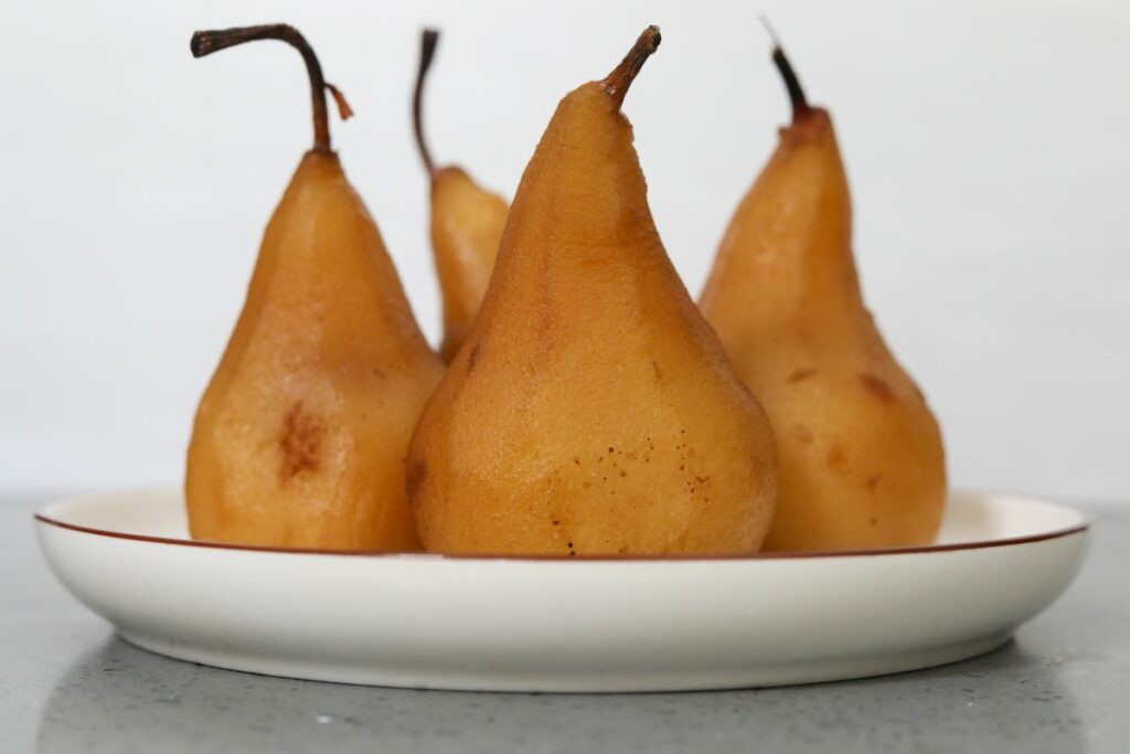 4 pears on a white plate