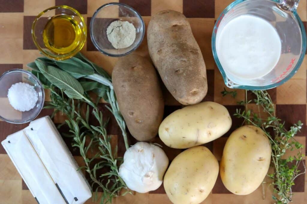 Roasted mashed potatoes ingredients on a wooden cutting board