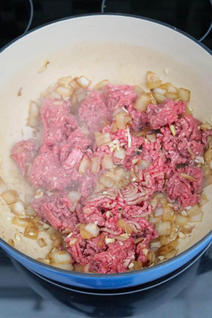 Ground beef added to Dutch oven