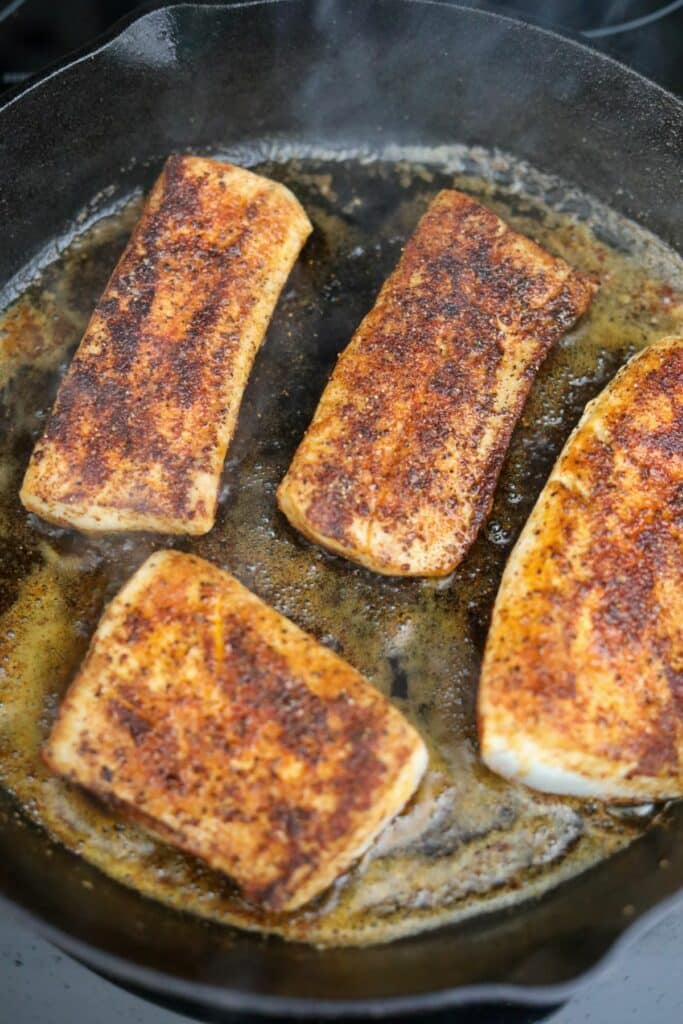 Seared fish in a skillet