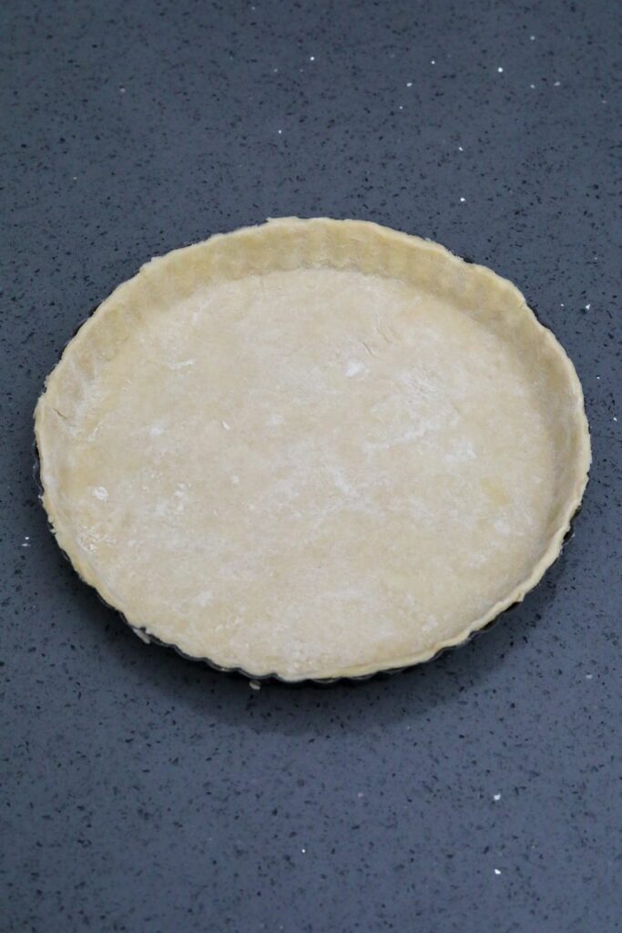 short crust dough in a tart pan