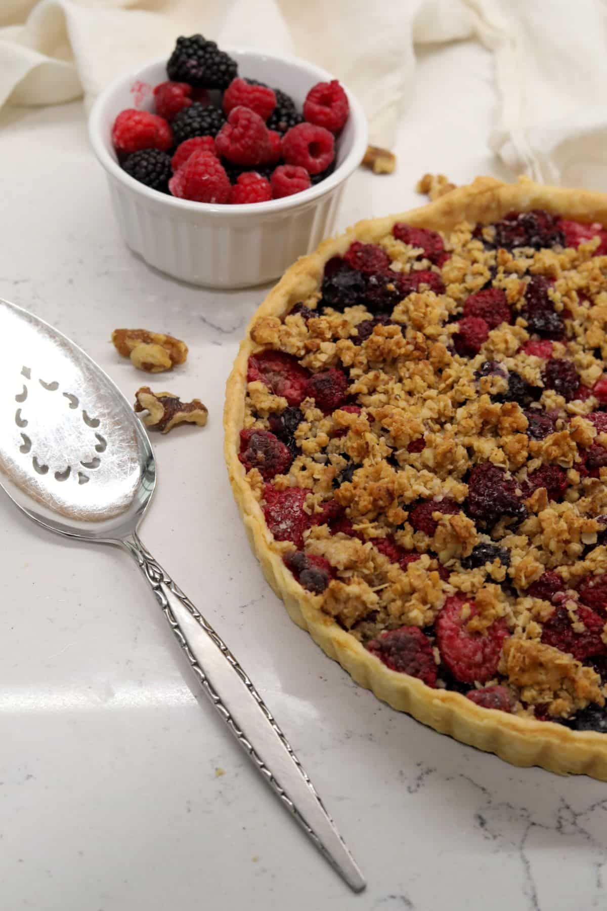 A berry trat with a pie spatula