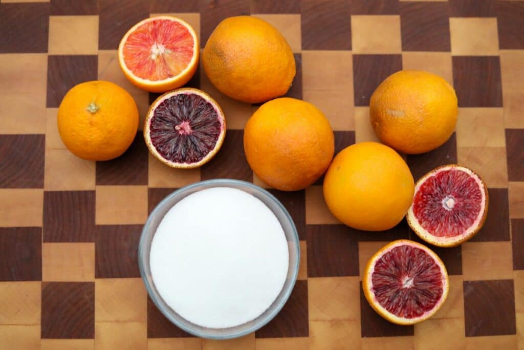 blood orange syrup ingredients on a wooden cutting board