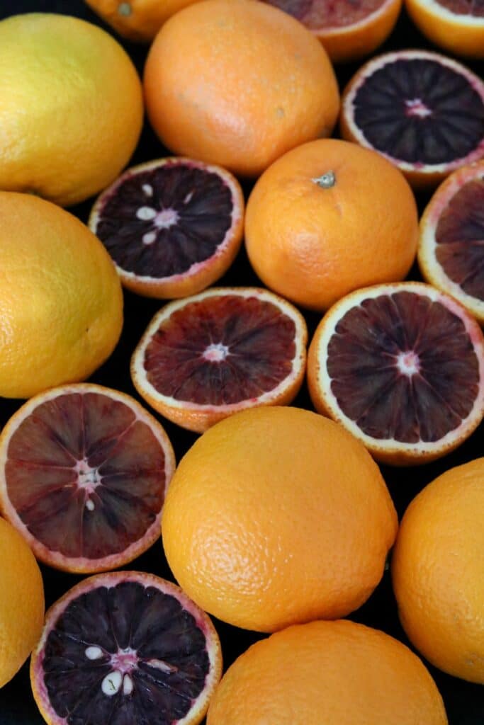 Sliced and whole blood oranges