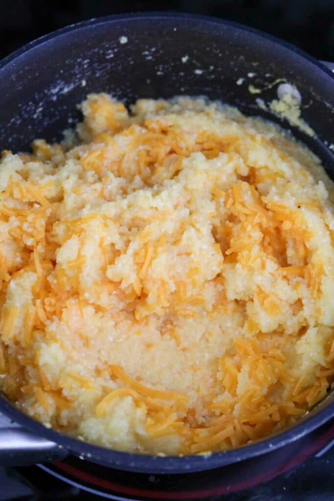Cheese added to a pot of grits