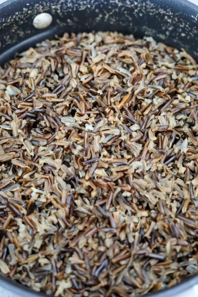 Cooked wild rice in a saucepan