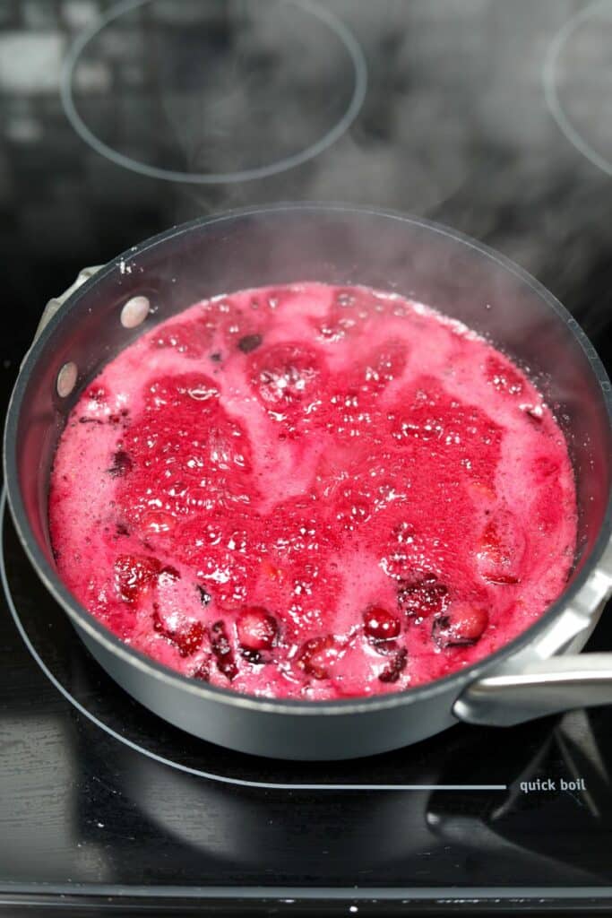Boiling the fruit filling in a sauce pan