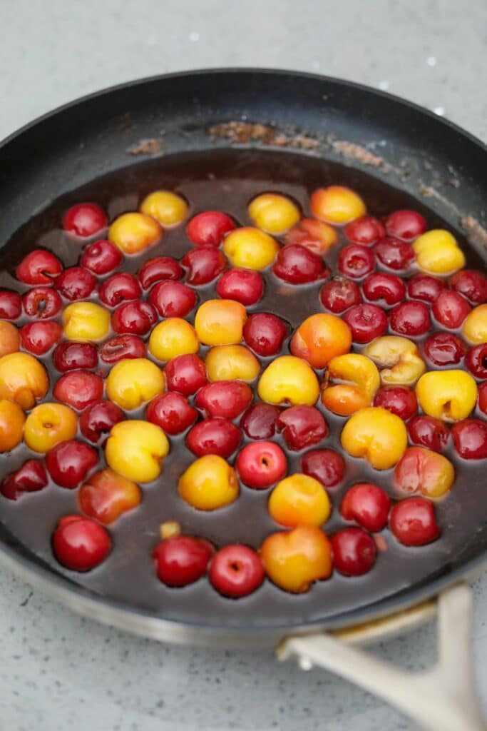 Cooked cherries jubilee in a pan