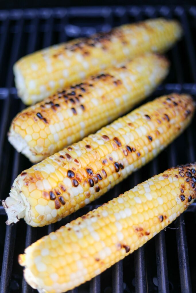 Charred corn on a grill