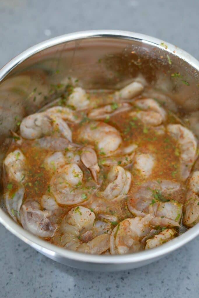 Shrimp marinating in a bowl