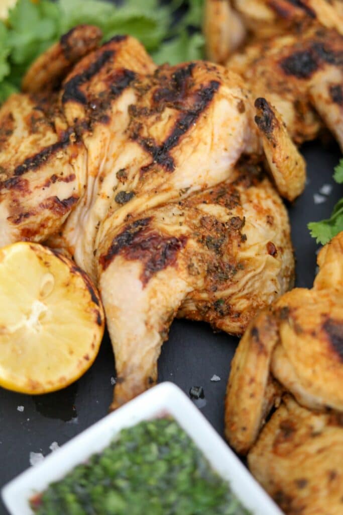 Close up of Cornish hens on a slate plate