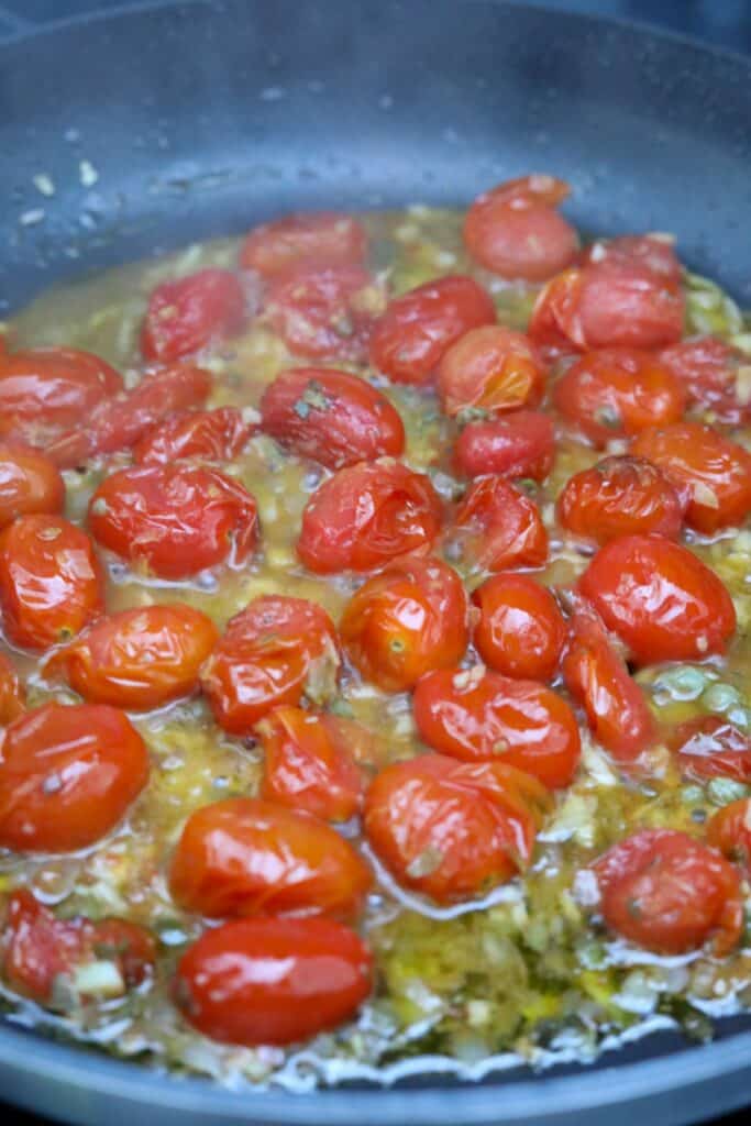 Cooking tomato sauce in a pan