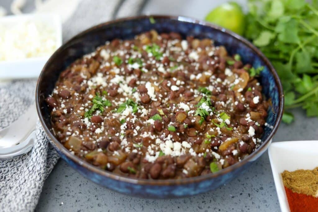 Mexican black beans in a blue bowl