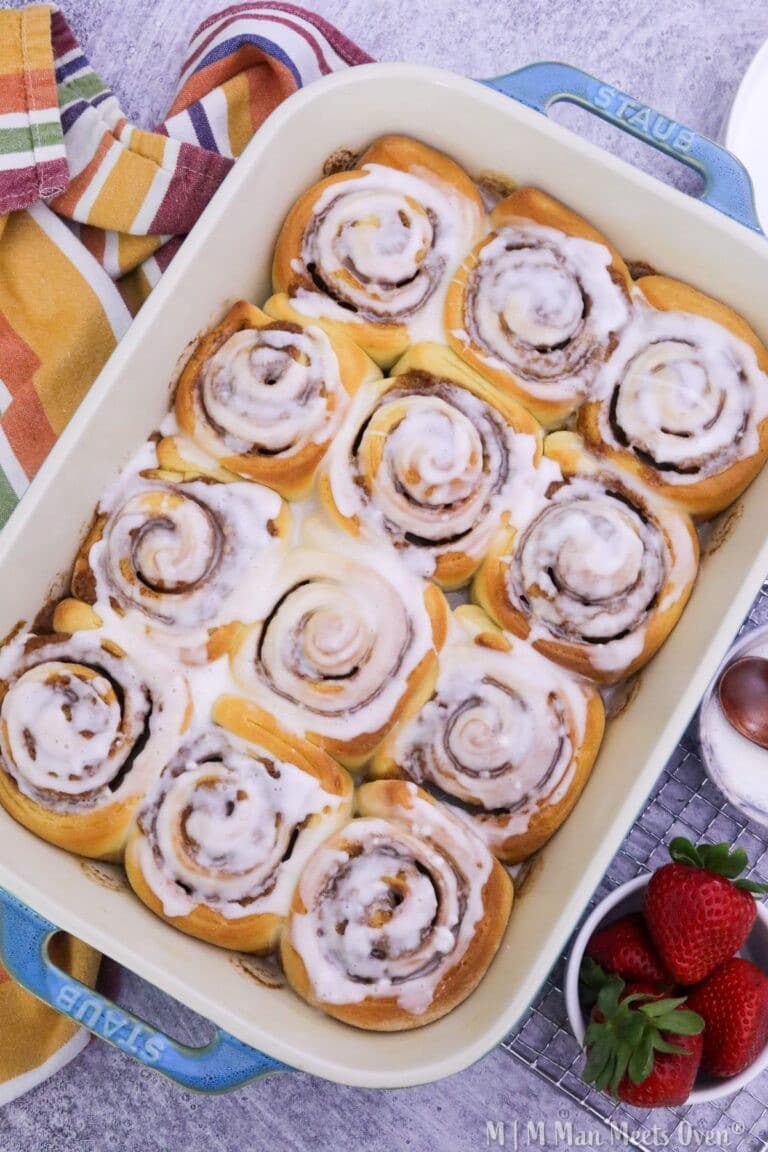 Cooked cinnamon rolls in a baking dish