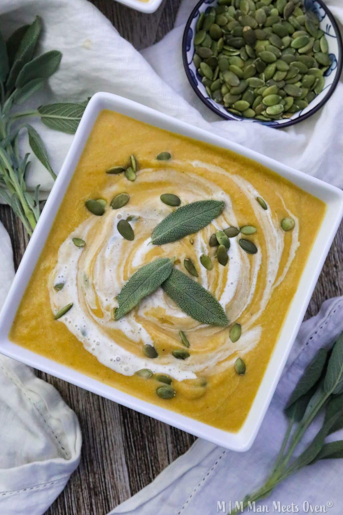 Maple and sage butternut squash soup in a white bowl