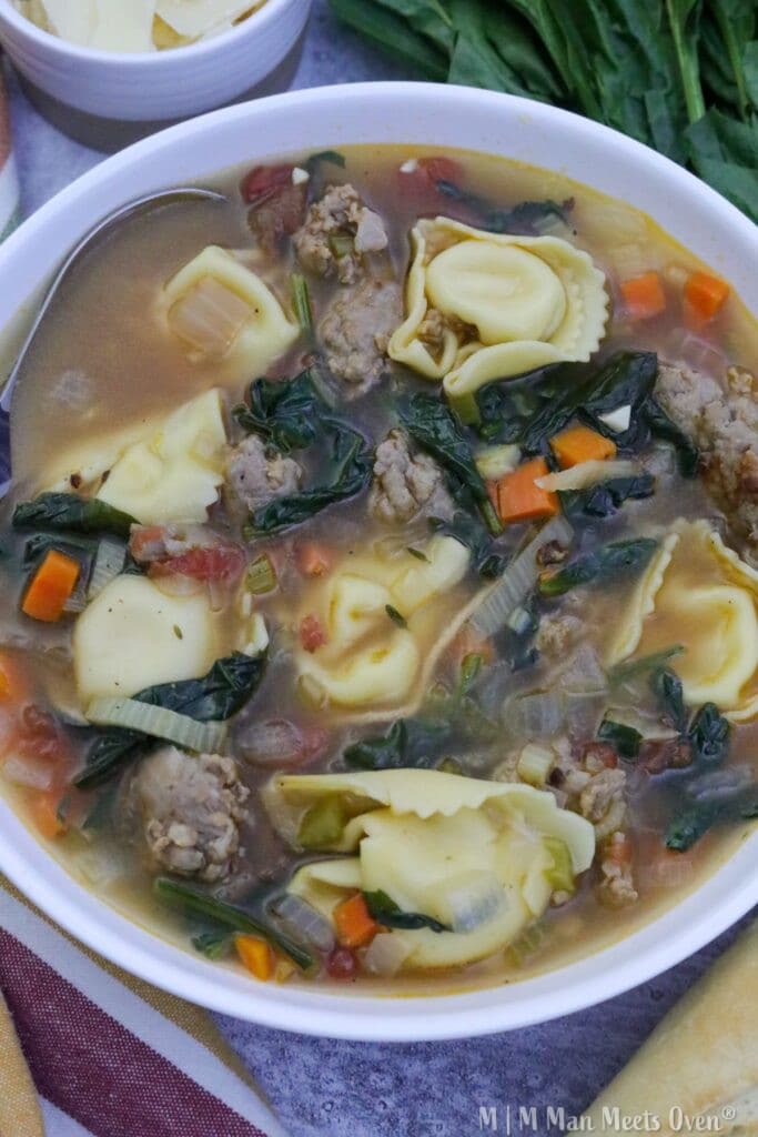 A large bowl of italian sausage tortellini soup