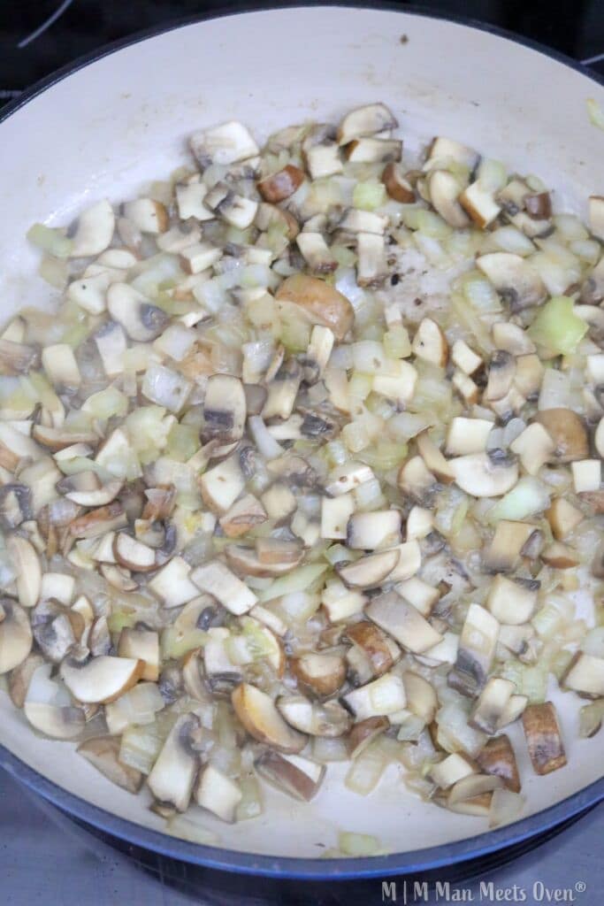 Sautéed mushrooms and onions in pan